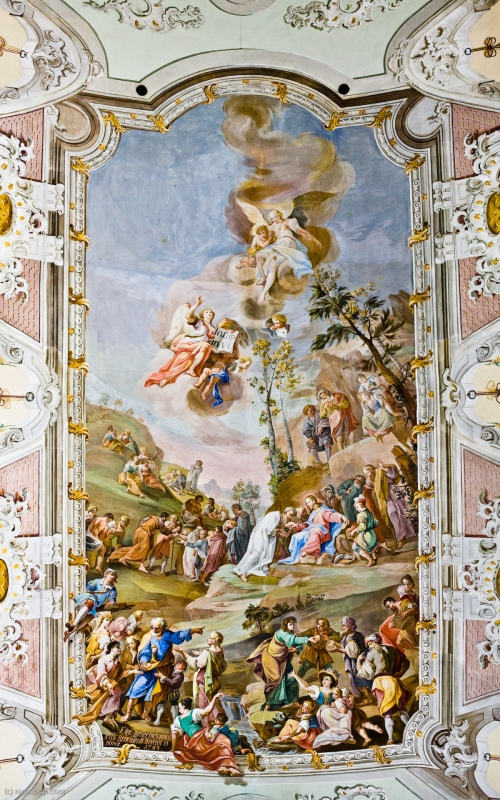 A panoramic photo (made of three individual 12 megapixel photos) showing the main ceiling mural of the Matrei cathedral, in Osttirol, Austria. The scene depicted is that of the feeding of the multitudes, where Jesus Christ multiplies a few loaves of bread and some fish to feed over 5,000 people. The original resolution of this panorama is 4209x5974 pixels.