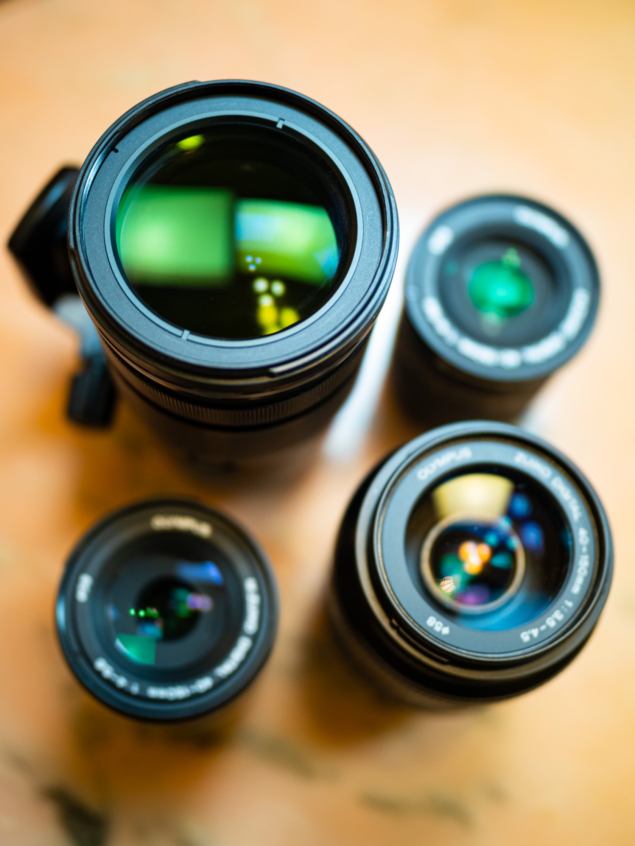 Four Olympus 40-150mm lenses